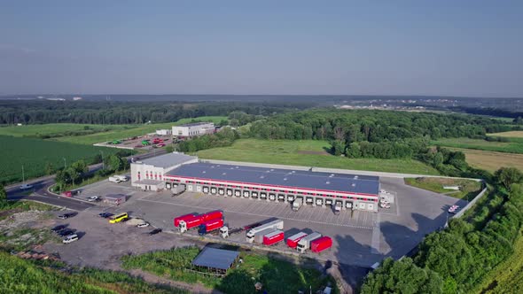 Semitrucks with Freight Trailers Standing at the Ramps alt