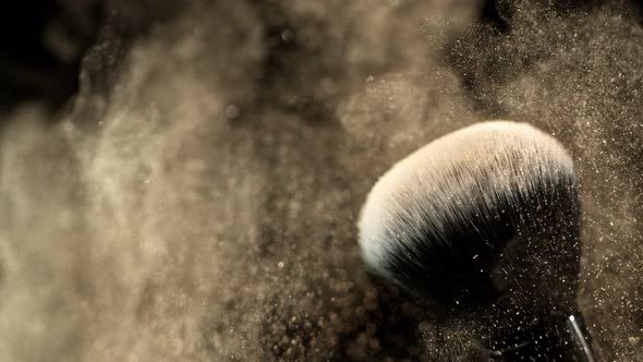 Super Slow Motion Closeup Shot of Makeup Powder Falling From Facial Brush at 1000Fps alt