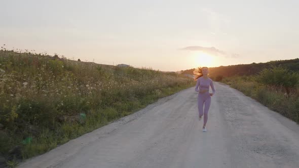 Front View of a Running Girl on Evening Runset alt