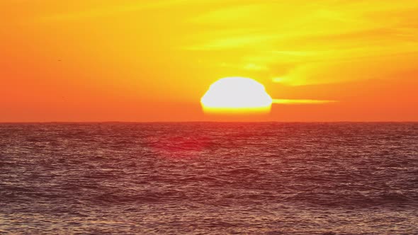 Golden sunset over ocean horizon