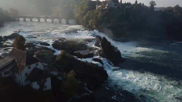 Aerial Revealing Shot Of Rhine Falls In Switzerland Early In The Morning  alt