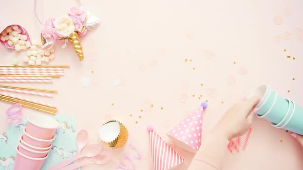 Birthday party in unicorn theme on pink flat lay. alt