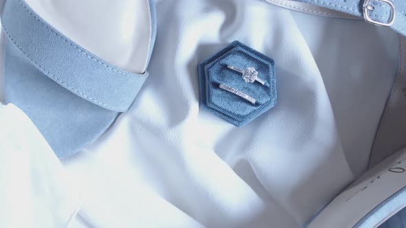 Beautiful diamond engagement and wedding ring set.  The camera orbits over a dreamlike pastel-colore alt