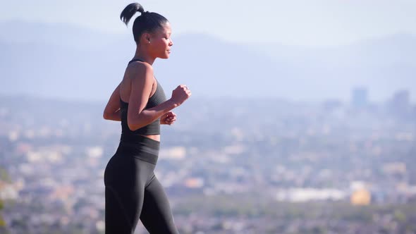 Mixed ethnicity woman Exercising in a park in Los Angeles alt
