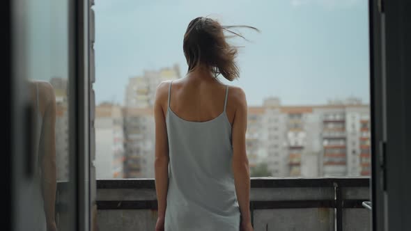 Rear View of a Young Woman Standing on Balcony at Home Slow Motionsocial Distancing and Self alt