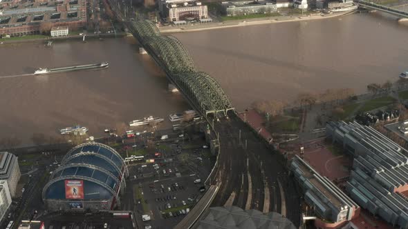 AERIAL: View Over Cologne Hohenzollern Bridge and Cathedral in Beautiful Hazy Sunlight  alt