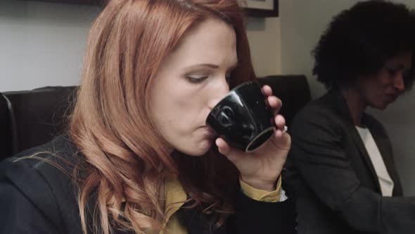 Businesswoman talking on phone in cafe