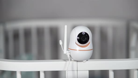 The Baby Monitor Camera with the Rotation Function Monitors the Child in the Room