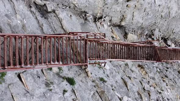Vertical orientation video: Scenic steep stairs in the rocks