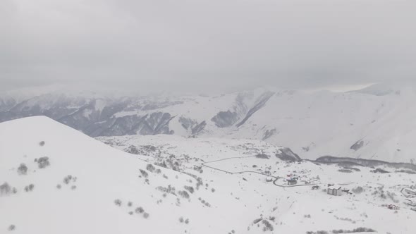Aerial view of beautiful snowy mountains in Gudauri. Georgia alt