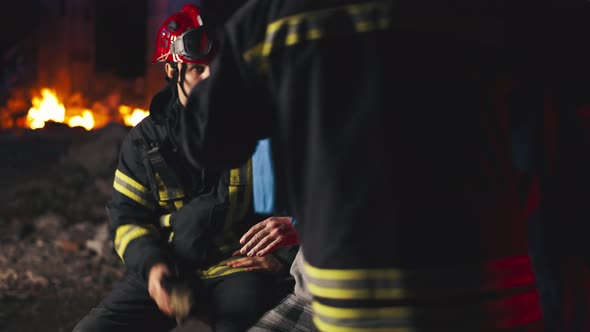 Emergency Service Workers Taking Care of Senior Survivor alt