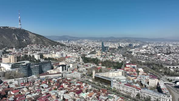 Aerial view of center of Tbilisi under Mtatsminda mountain, Georgia 2022 spring alt