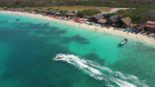 Tropical White Sand Beach, Water Scooter at Speed in Beautiful Crystal Clean Blue Water alt