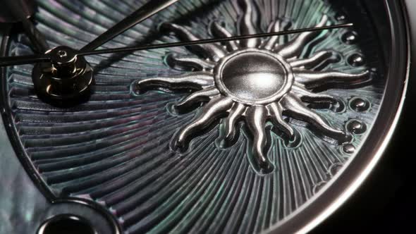 Rotating Swiss Watch with Sun Closeup alt