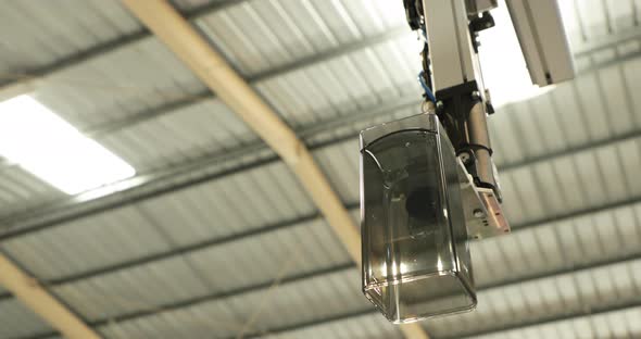 Plastic Part Ejected And Cooled Down In A Plastic Injection Moulding Factory. close up, tracking sho alt