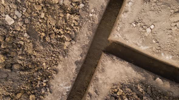 Dug Out Trench for Building Works of New House Concrete Foundation on Construction Site alt