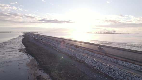 Cars driving on waterfront highway leading to Tsawwassen Vancouver ferry terminal, Canada. Aerial alt
