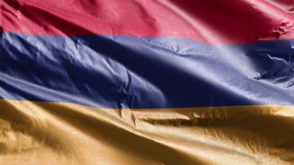 Armenia textile flag waving on the wind. Slow motion. 20 seconds loop.  alt