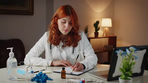 Young Italian Doctor Writes Prescription on Pen and Paper for Medicines alt