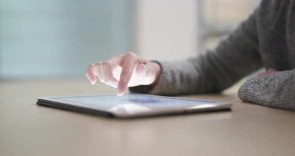 Woman use of digital tablet computer alt