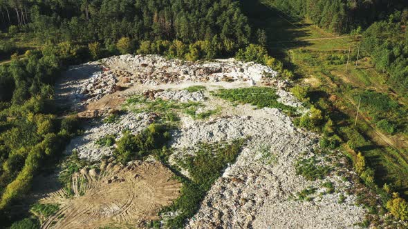 Aerial View Of Domestic Garbage Near Green Forest. Bird's-eye View Of Junk. Domestic Waste In alt