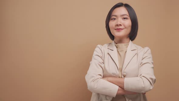 Confident business asian woman happy standing and crossed arms with copy space isolated