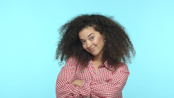Slow Motion of Confident and Sassy Young Woman with Curly Hair Cross Arms on Chest Pointing at Her