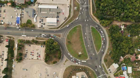 Aerial View, Roundabout, Cars Parked on the Roundabout. Modern Motor Road in the City, Parking