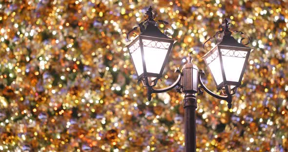 Christmas tree decoration and street lamp alt