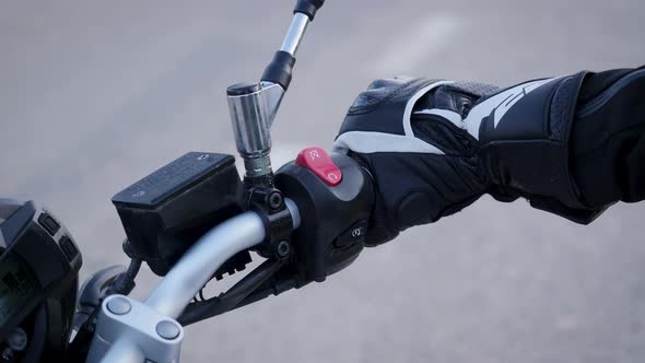 Motorcyclist's Hand Twisting Throttle Handle