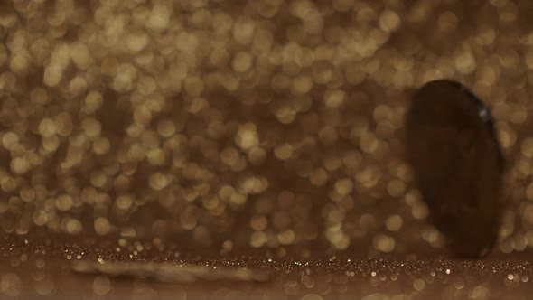 Close Up on gold background with bokeh. Bitcoin BTC coin. New virtual currency. alt