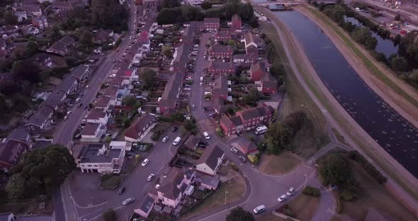 High Altitude Drone Flight Over A Suburban Community at sunset alt