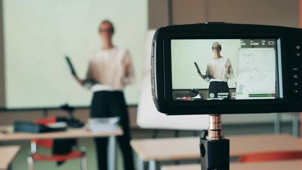 Female Tutor is Teaching an Internet Lesson and Being Filmed alt