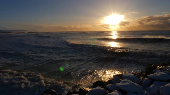 Iceland Winter View of Crashing Ocean Waves at Sunrise