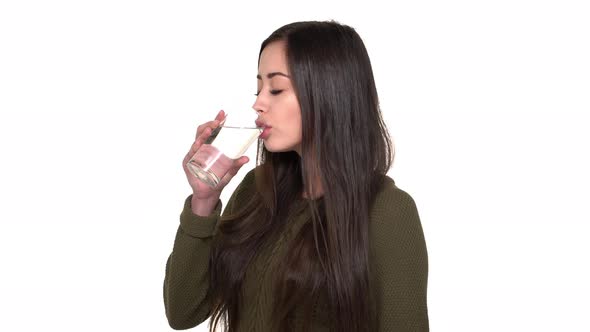 Halfturned Portrait of Healthy Woman with Long Brown Hair Being Dehydrated Drinking Mineral Water alt