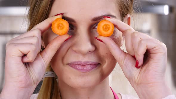 Girl Playing with Carrots on Eyes