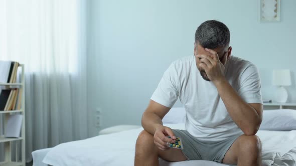 Upset Man Starts Taking Medicines to Treat Desease, Midlife Crisis Problem alt