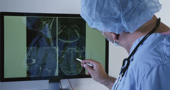 Surgeon Reviewing MRI Scans 10
