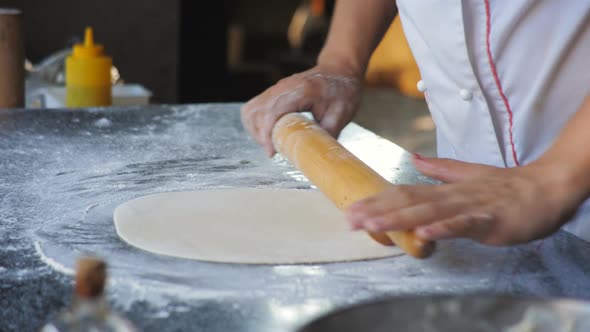 Cooking Focaccia By a Chef in a Restaurant