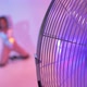 out of focus girl dancing in front of a fan - VideoHive Item for Sale