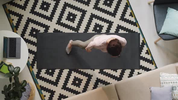 Young Woman Doing Stretching Workout at Home alt
