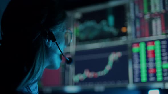 Trader is Working with Multiple Computer Screens with Charts and Data Analysis and Stock Broker alt