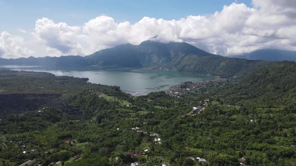 Aerial view of Batur lake Kintamani Bali with cloud in the background alt