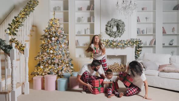 Family Rejoices at Christmas, Have Fun with Gifts