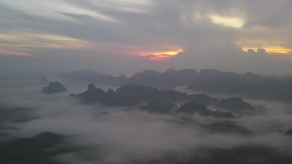 Timelapse of sea of fog with sunrise cover mountain in area of Doi Ta pang southern Thailand