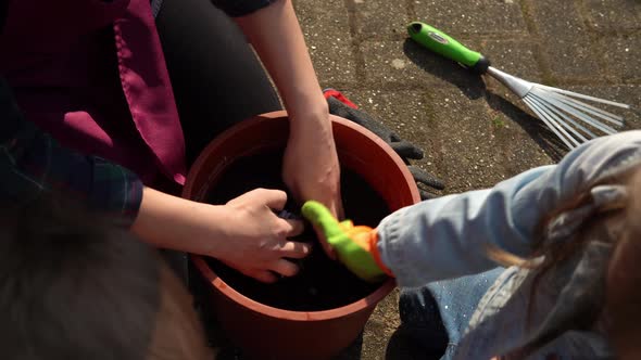 Happy Preschool Little Girl Kid Daughter Wear Works Gloves Humic Boots Planting Flowers in Pot in