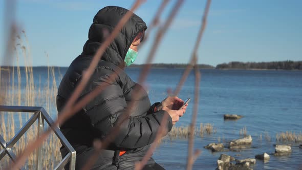 An Umemployed Lady Constantly Checking Her Phone in Finland