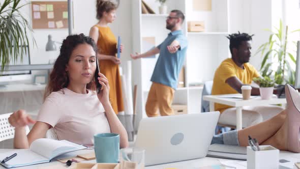 Female Manager Working with Gadgets in Office alt