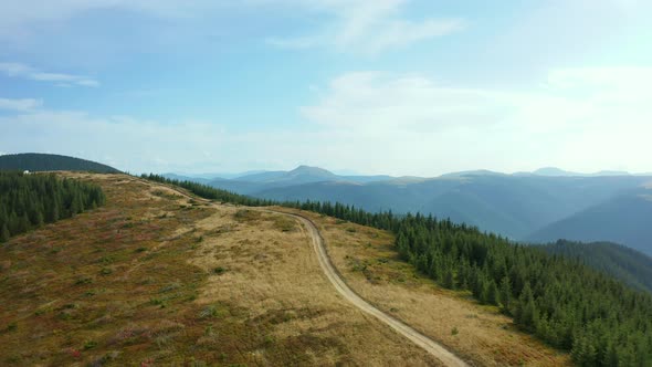 Aerial Mountain Path Scene with Stunning Rocky Pikes Background Against Sky alt