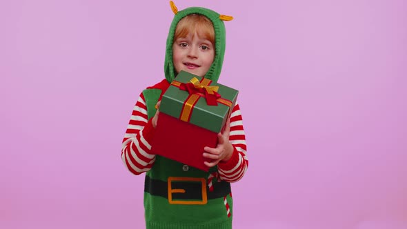 Funny Teen Toddler Girl Kid in Christmas Santa Costume Presenting Christmas Gift Box Shopping Sale alt